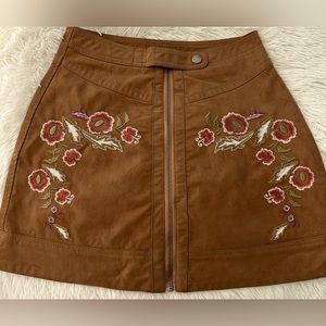Free People mini skirt with embroidery. Size 2, color brown. Mint condition.